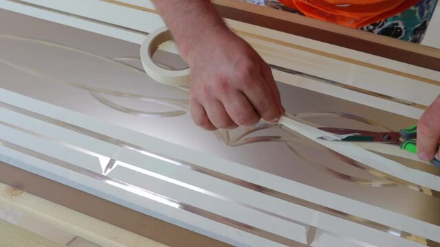 pasting door glass before applying paint to it