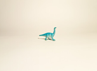 
toy dinosaur, diplodocus blue on a white background