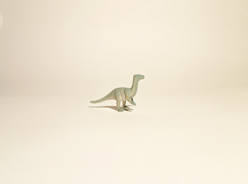 
toy dinosaur, gray carnosaurus on a white background