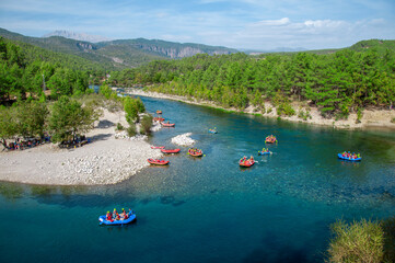 Koprucay or koprulu river valley with Taurus mountains and rocks, Turkey. Famous by its rafting spots. Stream rapids at the foreground © stdemiriz