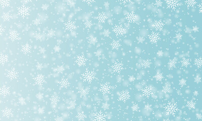 Snow background. Winter snowfall. White snowflakes on blue sky. Christmas background. Falling snow.