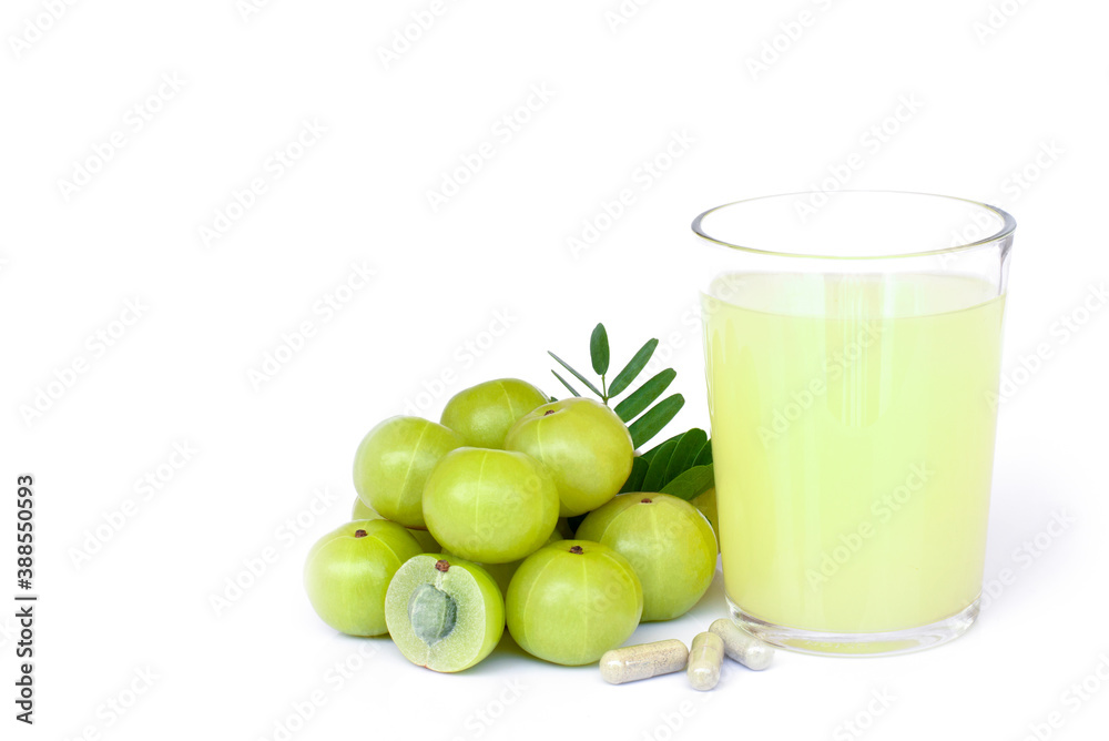 Wall mural amla or indian gooseberry fruits ( phyllanthus emblica ) with capsule and glass of gooseberry juice 