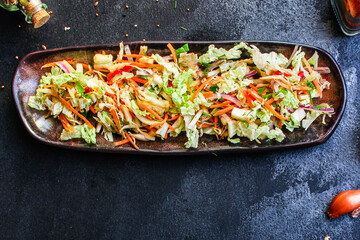 fresh salad vegetables Chinese cabbage, carrot, onion, pepper and more meal on the table tasty top view copy space for text food background rustic keto or paleo diet