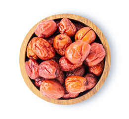 Dates fruit in wooden bowl on white.
