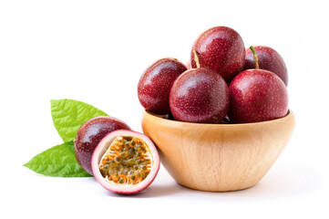 Passion fruit ( Maracuya ) in wooden bowl isolated on white background .