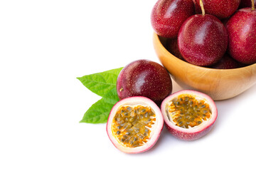 Passion fruit ( Maracuya ) in wooden bowl isolated on white background .