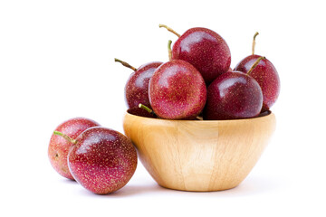 Passion fruit ( Maracuya ) in wooden bowl isolated on white background .