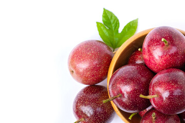 passionfruit ( Maracuya ) in wooden bowl isolated on white background . top view.