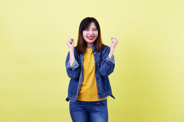 Charming brunette Asian woman posing in the studio