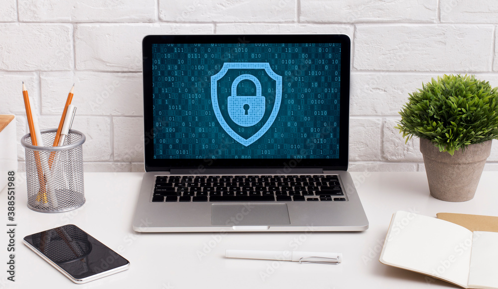 Poster laptop on table with padlock icon on the screen