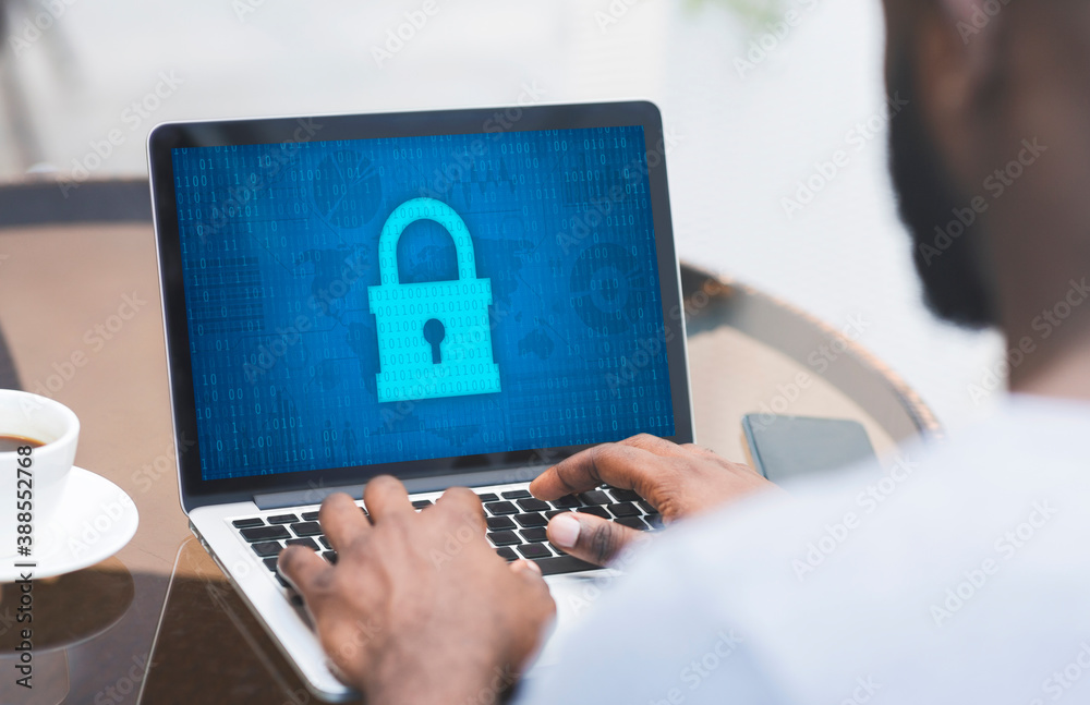 Poster man typing on laptop keyboard, padlock icon on the screen