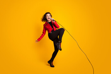Fototapeta na wymiar Full length body size view of nice cheerful glad wavy-haired girl vocalist jumping singing hit isolated on bright yellow color background