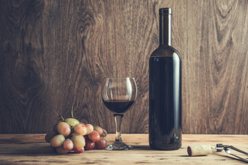 grapes wine bottle and glass with opener