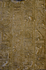Egyptian ancient hieroglyphs on the stone wall