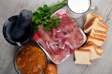 Ingredients for fish cutlets, meatball or fish croquettes. Fresh fish meat, bread, milk, onion, fish caviar and parsley, salt. Copy space