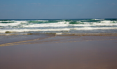 Fototapeta na wymiar Scenic view of sandy beach at low tide