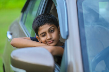 Cute Indian child showing face expression in car