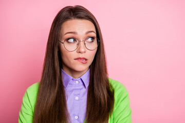 Close-up portrait of nice discontent girl worrying biting lip looking aside copy space isolated...