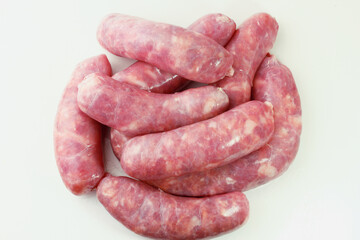 pile of fresh raw pork meat sausage isolated on white background