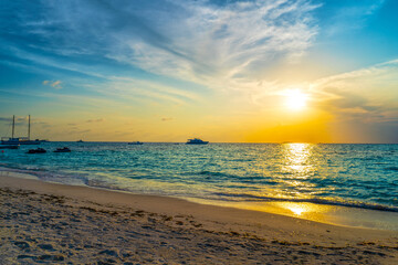 Naklejka na ściany i meble Sunrise on the tropical sea.Fabulous tropical island.
