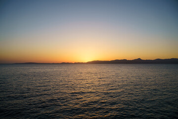 Beautiful orange sunset by the sea in Mallorca, Spain