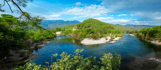 Fototapeta na wymiar Koprucay or koprulu river valley with Taurus mountains and rocks, Turkey. Famous by its rafting spots. Stream rapids at the foreground