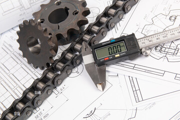 Driving industrial roller chain, digital caliper and sprocket on a print engineering drawings