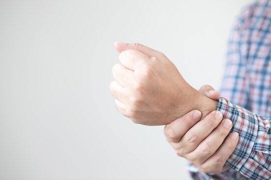 Image of man holding on the wrist,fist bump.