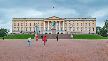 A large image of the main facade of the residence of one of the European monarchs on an overcast summer day