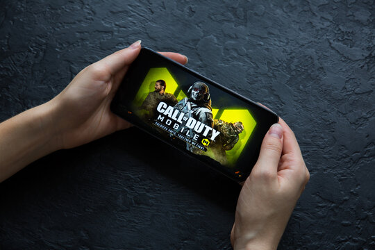 LVIV, UKRAINE - October 25, 2020 : Playing mobile game Call od Duty on modern smartphone.