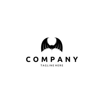 Silhouette of Bat Isolated on White Background Logo Design Inspiration. Halloween Decorative Element.