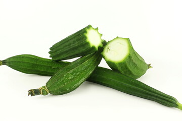 luffa gourd or ridge gourd indian vegetable closeup on white background