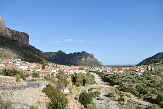 Panoramic view of Leonidio village and Parnonas Mountain at South Kynouria, Arcadia, Peloponnese, Greece. Blue sky, greek traditional village and mountain