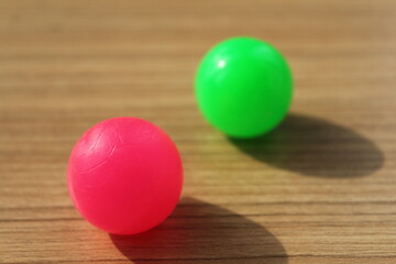 clear pink and blurred green balls