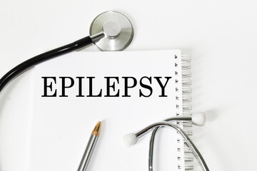 medical text EPILEPSY on the card. white background, stethoscope, medicine. medical concept