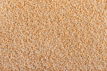 Sesame seeds background. Organic dry sesame seeds.