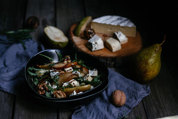salad with pear nuts arugula and cheese