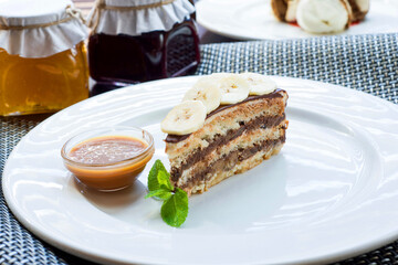 Delicious banana dessert on a white plate.