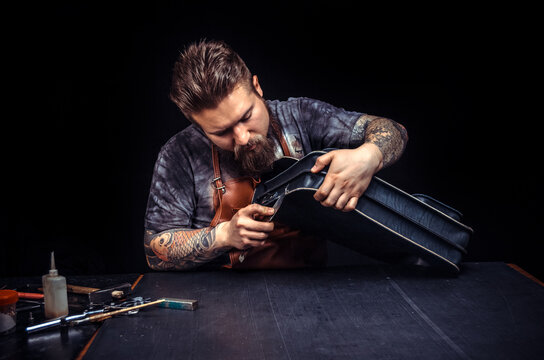 Professional Tanner working as artisan at his leather studio