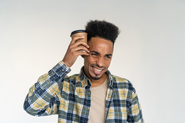 Young afro american man holding cup of take away coffee isolated over white background