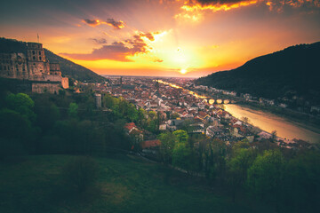 Germany Heidelberg a beautiful view of the entire city from the castle. Sunset backlit and a great colorful sky - obrazy, fototapety, plakaty