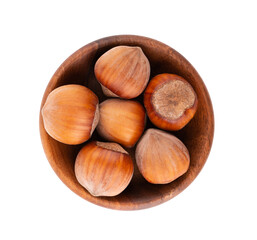 Hazelnut in wooden bowl, isolated on white background. Nut macro. With clipping path. Top view.