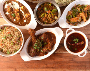 Assorted indian food on wooden background. Dishes and appetizers of indian cuisine