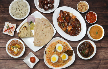 Assorted indian food on wooden background. Dishes and appetizers of indian cuisine