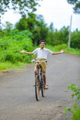indian little boy enjoy cycle riding