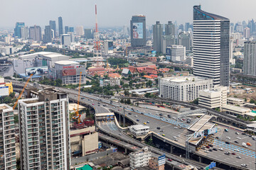 BANGKOK, THAILAND - SEPTEMBER-23-2020 : Aerial view of busy cars with traffic jam in the rush hour on highway road street on bridge in downtown, urban city in Asia. Intersection junction.