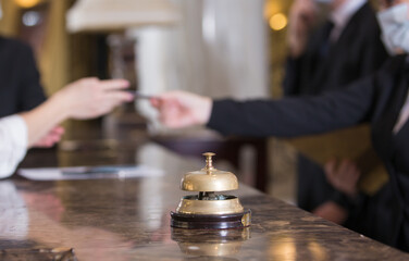 the staff of an elite hotel serves guests