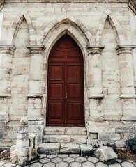 entrance to the ancient wooden door of a gothic temple