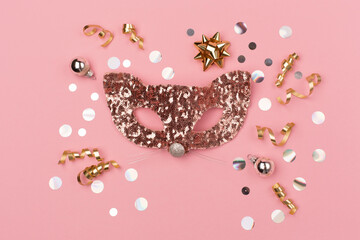 Christmas holiday greeting card template. Carnival cat mask, gold and silver decorations, mirror disco balls on amaranth pink background. 