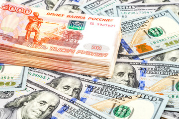 Five thousandths banknotes of russian roubles and dollars
